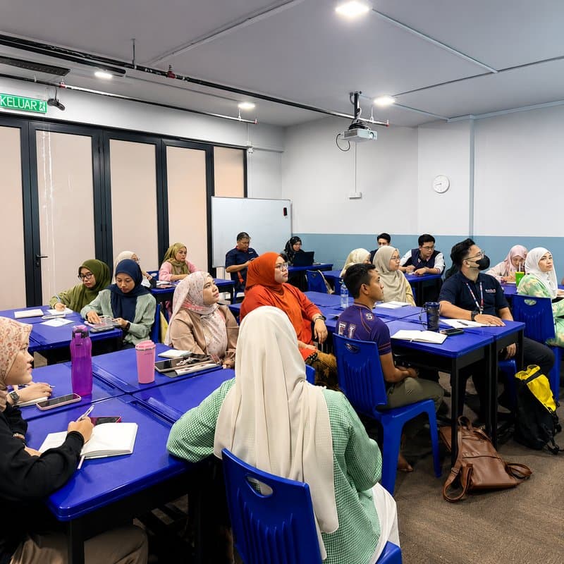 Falih Junior school leader presenting to staff during a professional development session